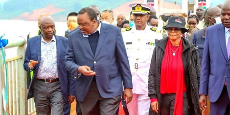 Gatundu North MP Wanjiku wa Kibe accompanies President Uhuru Kenyatta during the commissioning of the Karimenu II Dam in Gatundu on August 1. 2022