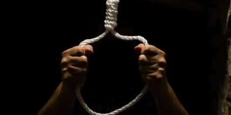 An image of hands holding a hanging rope.