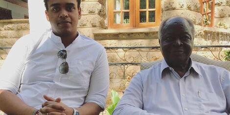 Kenya's third President Mwai Kibaki (right) with his Grandson Kibaki Junior pose for a photo at his Othaya home.