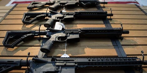 Several guns laid on a table