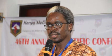 Dr Lukoye Atwoli addresses a gathering at a conference in 2019 in Nairobi