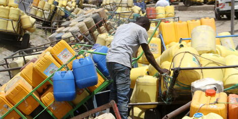 Water Vendors wait for their turn to fetch water at Kitengela on July 21, 2018.