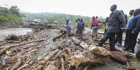 https://www.kenyans.co.ke/files/styles/article_style_mobile/public/images/news/passengers_from_stranded_vehicles_stand_next_to_the_debris_from_floodwaters_on_the_road_from_kapenguria_in_west_pokot_county._november_28_2019.jpg?itok=4IzBcPqX